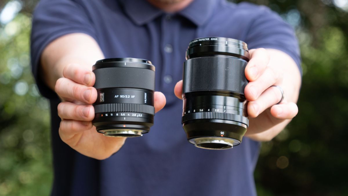 Viltrox AF 90mm f/2.2 EVO lens held alongside the Fujifilm XF 90mm f/2 lens by tech journalist and pro photographer Tim Coleman