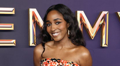 Ayo Edebiri attends the 76th Primetime Emmy Awards at Peacock Theater on September 15, 2024 in Los Angeles, California wearing a black and orange sequin gown