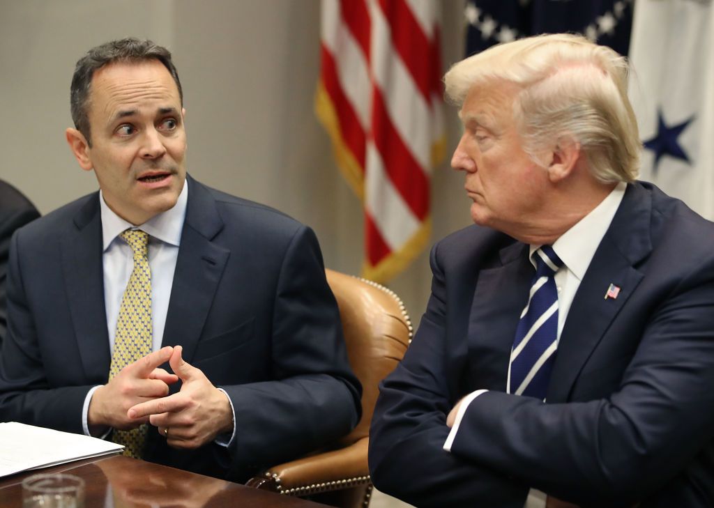 President Donald Trump listens to Kentucky Governor Matt Bevin speak