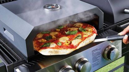 Aldi BBQ pizza oven cooking pizza on grill