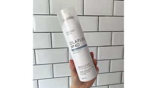 Image of Olaplex 4D Dry Shampoo on white tiled background