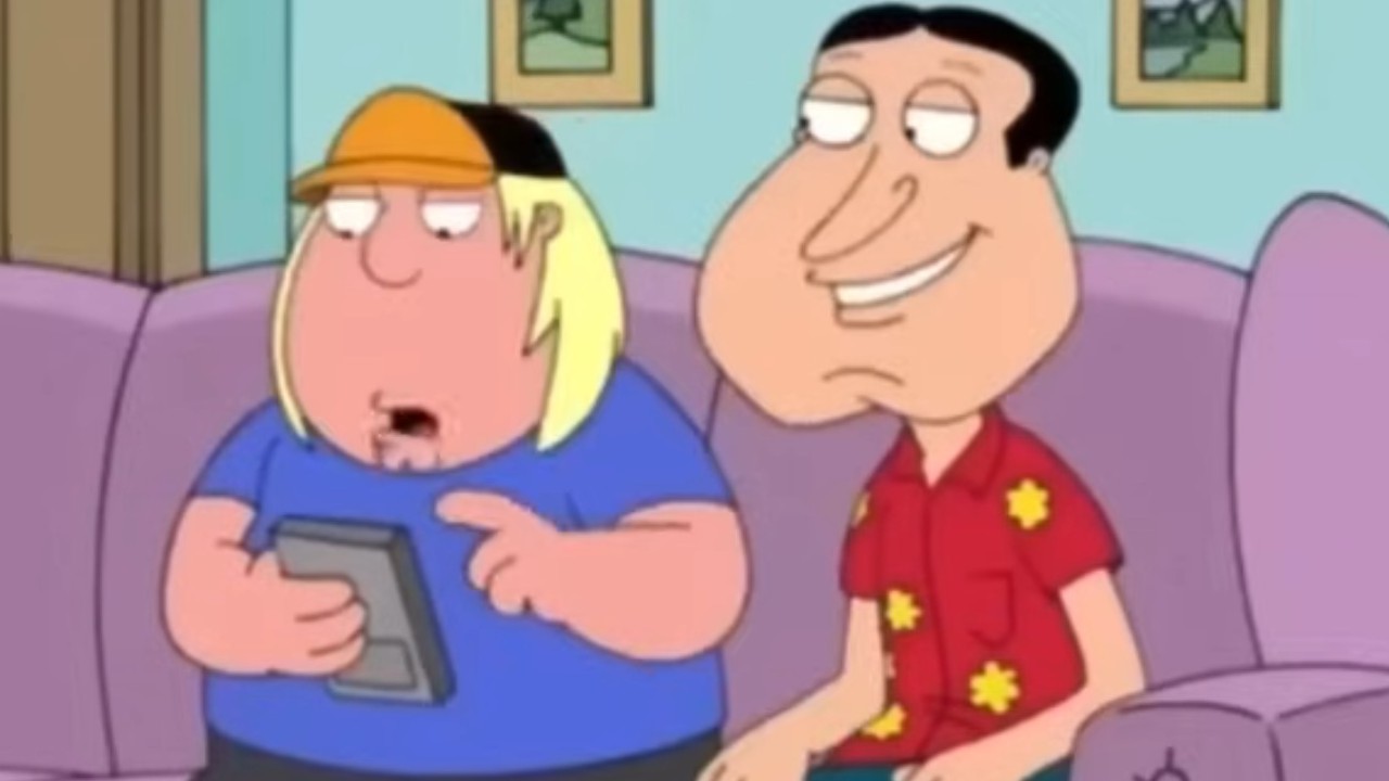 Quagmire sitting on the couch with Chris in Family Guy