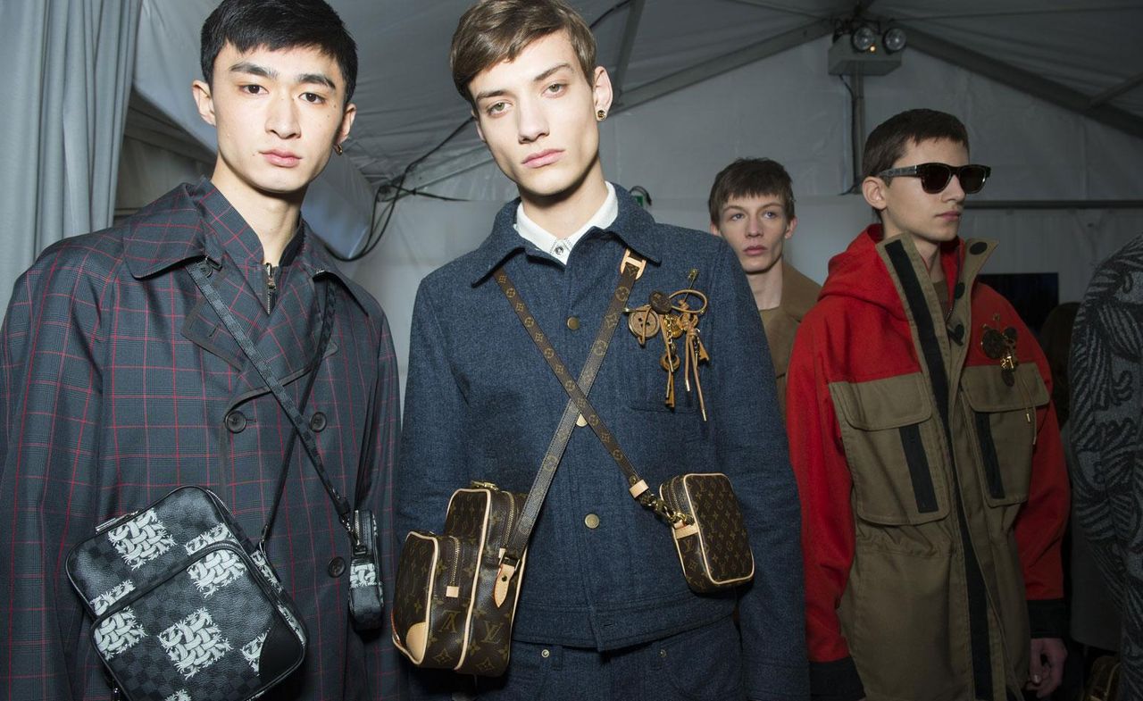 2 male models looking towards the camera in Louis Vuitton clothing &amp; accessories