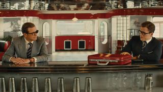 Colin Firth and Taron Egerton sitting at a diner counter in Kingsman: The Golden Circle.
