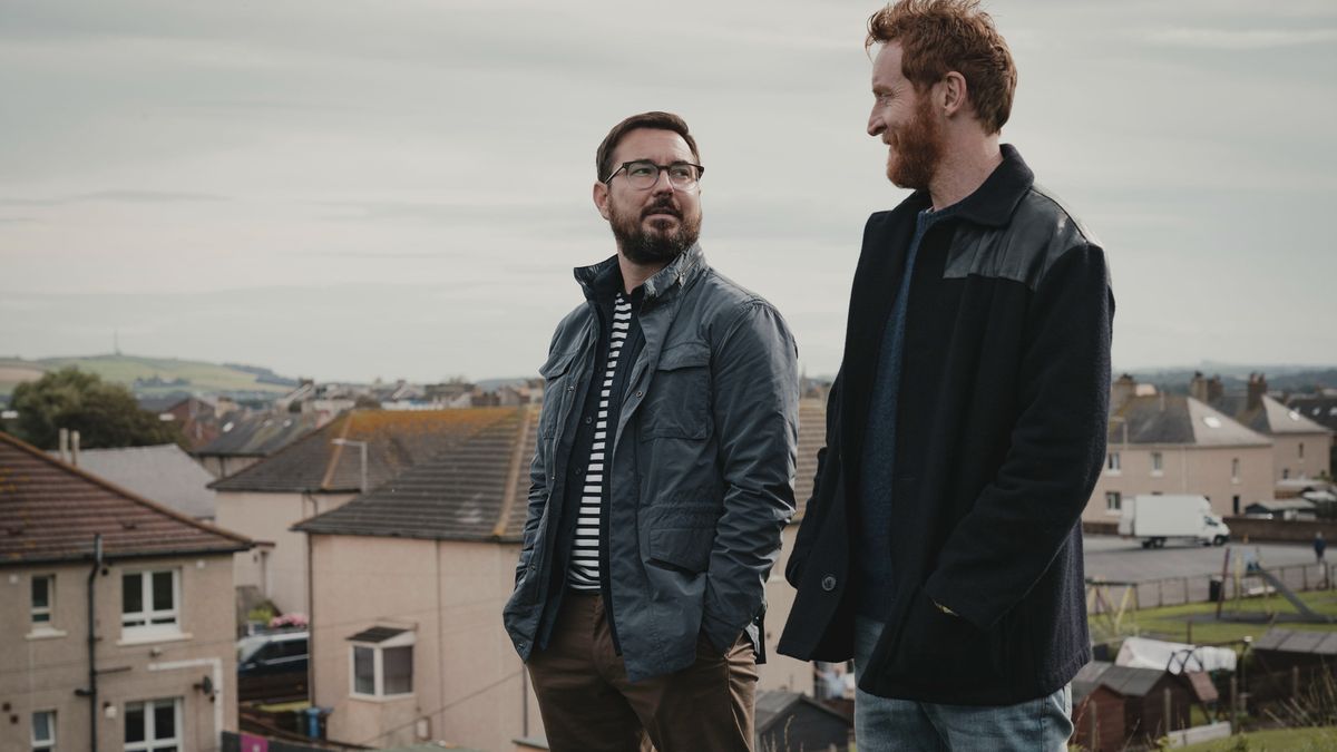 James (Martin Compston) and Tully (Tony Curran) standing on a hill in Mayflies