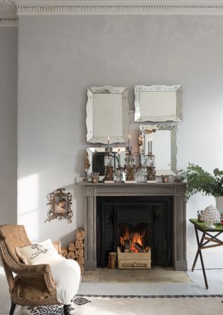 how to reopen a hidden fireplace: fire place with statement mirrors