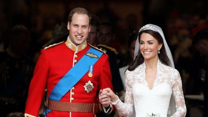 Kate Middleton smiling in a carriage on her wedding day to Prince William in April 2011