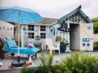 Cuprinol shed of the year: A shed painted with light blue and white stripes