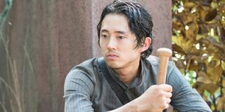 Steven Yeun holding a bat in The Walking Dead