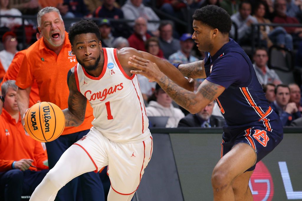 Jamal Shead #1 of the Houston Cougars drives the ball against K.D. Johnson #0 of the Auburn Tigers during the first half in the second round of the NCAA Men&#039;s Basketball Tournament at Legacy Arena at the BJCC on March 18, 2023 in Birmingham, Alabama.