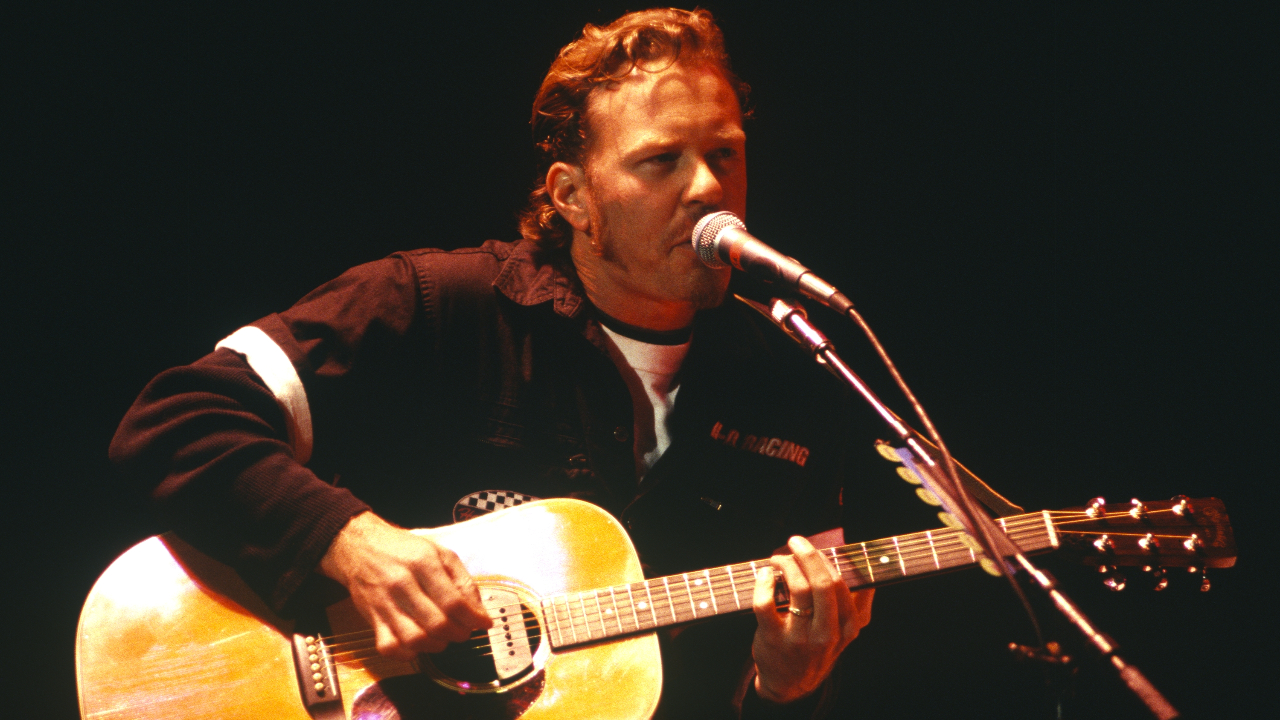 James Hetfield of Metallica onstage with an acoustic guitar in 1997