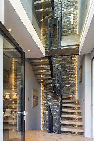 lighting ideas for every level of a staircase