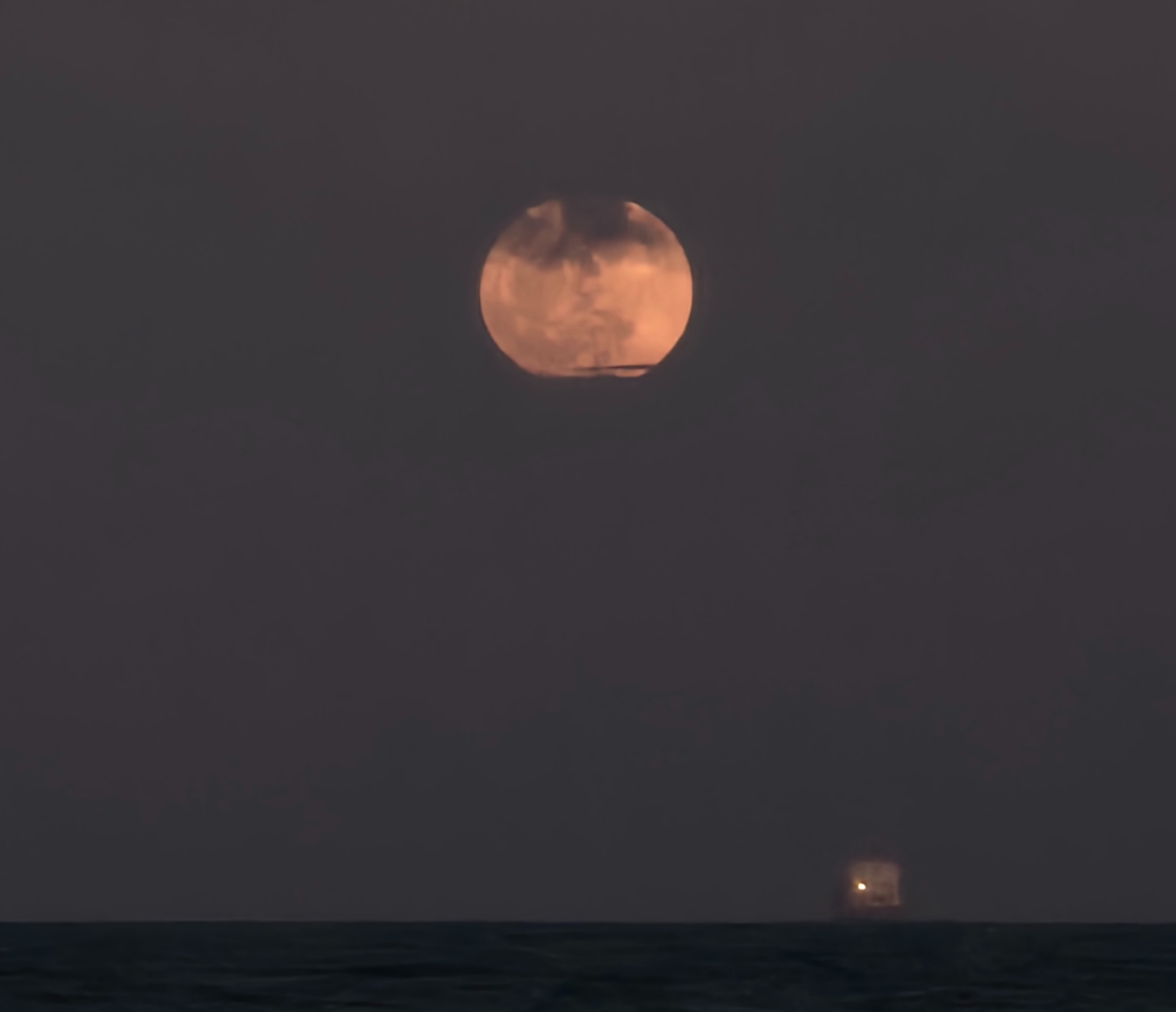 The full Strawberry Moon of June 2024 shines over Fort Lauderdale Beach in Florida despite a cloudy sky in this photo by Lisa Shislowski on June 21, 2024.