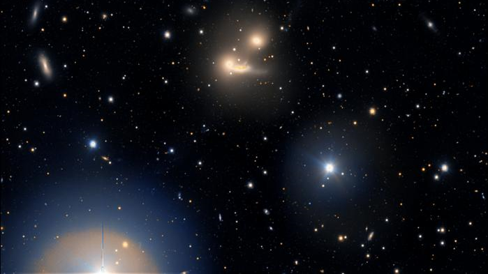 World’s largest visible light telescope spies a galaxy cluster warping spacetime Space
