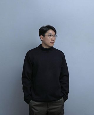 A portrait of Korean designer Jinsik Kim