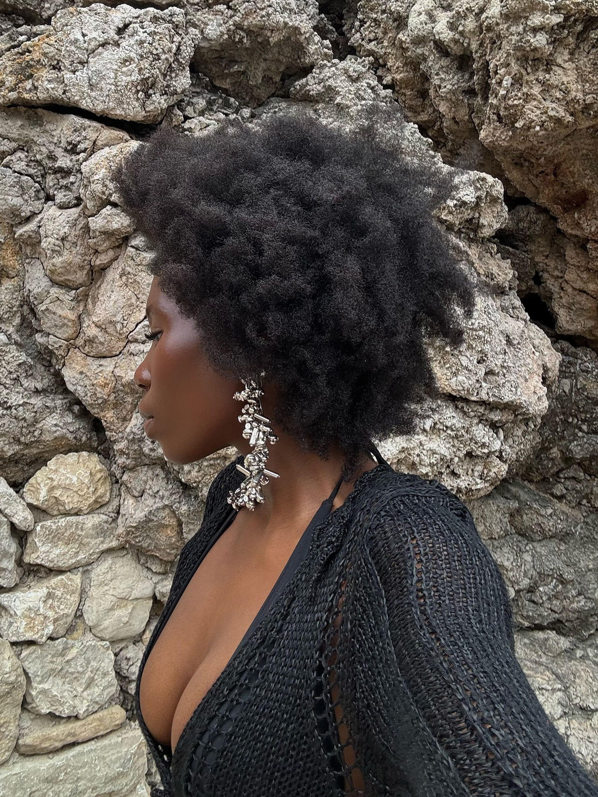 Danielle Jinadu with full curls and glowing skin