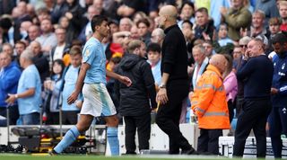 Rodri walks past Pep Guardiola following his red card in Manchester City's win over Nottingham Forest in September 2023.