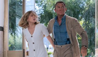 A bloodied Daniel Craig escorts Lea Seydoux to safety in No Time To Die.