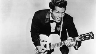 Photo of Chuck BERRY; Posed studio portrait of Chuck Berry with Gibson guitar