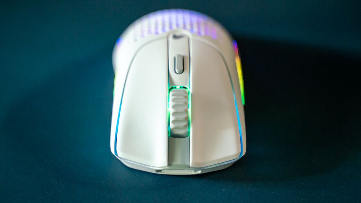 Glorious O2 Wireless on a dark blue desk pad