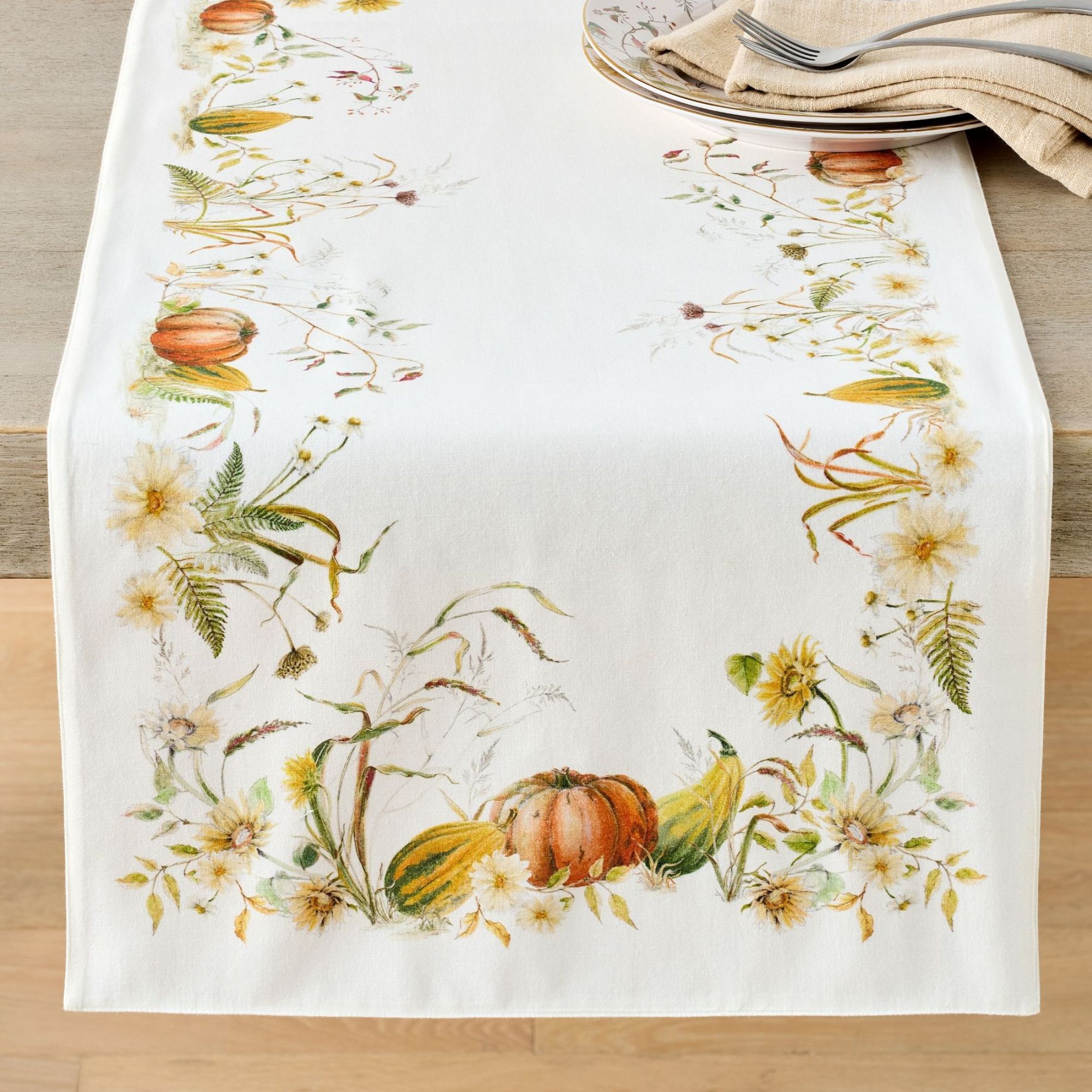 White table runner with yellow flowers and pumpkin prints