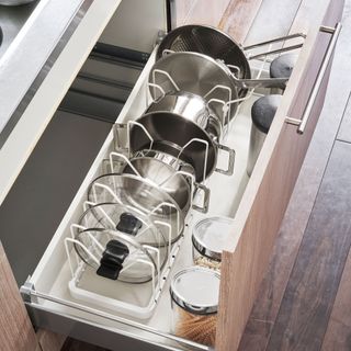 Open drawer with organiser to stack pans and lids