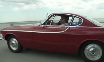 Irvin Gordon is seen driving his Volvo P1800S, he has been driving the same car since 1966 and is 34,000 miles away from reaching the 3 million mile mark.