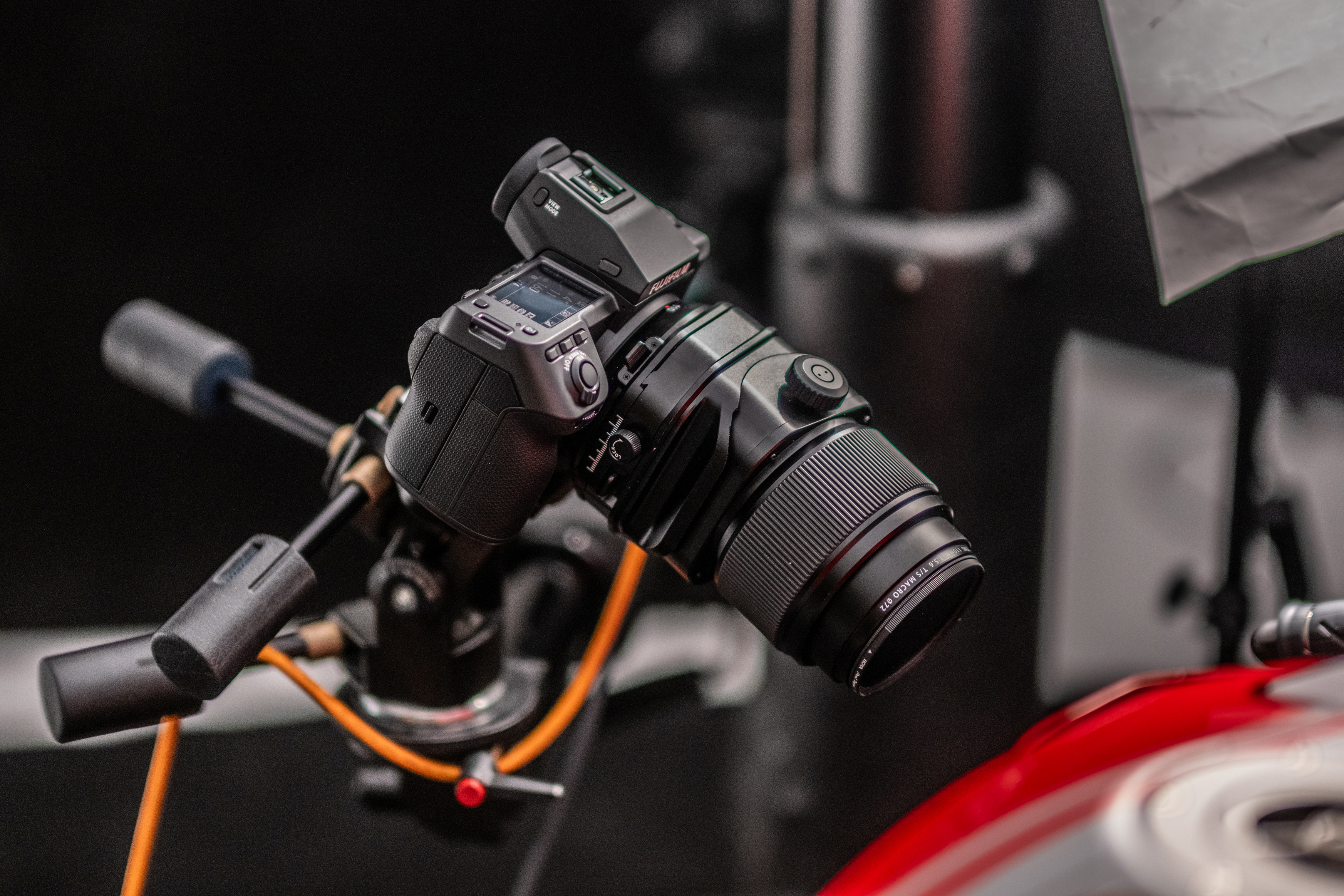 The Fujifilm GFX100 II on a tripod in a studio