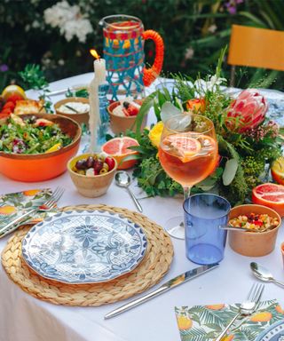 Outdoor birthday party ideas with orange and blue tableware