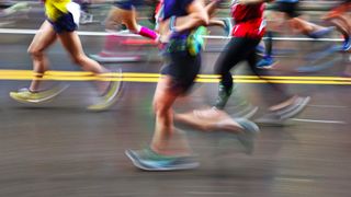Blurred Action Of Marathon Runners On City Street