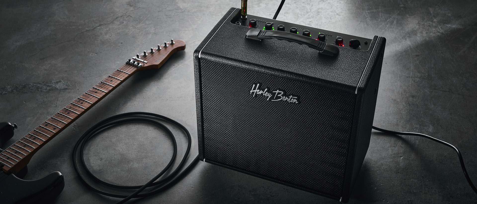 Harley Benton DNAFX AmP20: the compact 1/8&quot; modelling combo is finished in black and photographed in close-up and against a slate floor