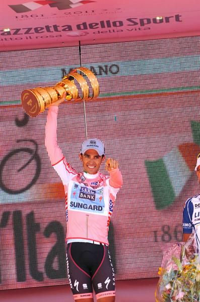 Alberto Contador shows off the Giro d'Italia's winner's trophy.