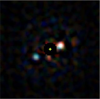 A simulation of what Project Blue's telescope could see near Alpha Centauri after blocking light from the two stars.