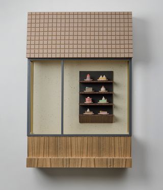 Artwork of display case with tiny cakes