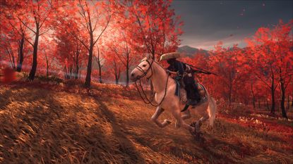 Playing Ghost of Yotei and riding through an autumnal forest with red leaves 