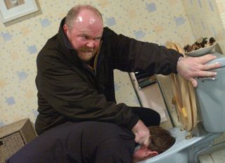 Phil Mitchell flushes Ian Beale's head down the toilet