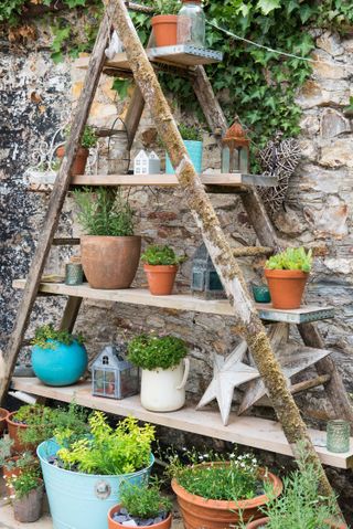 patio gardening ideas: potted plants on wooden A frame