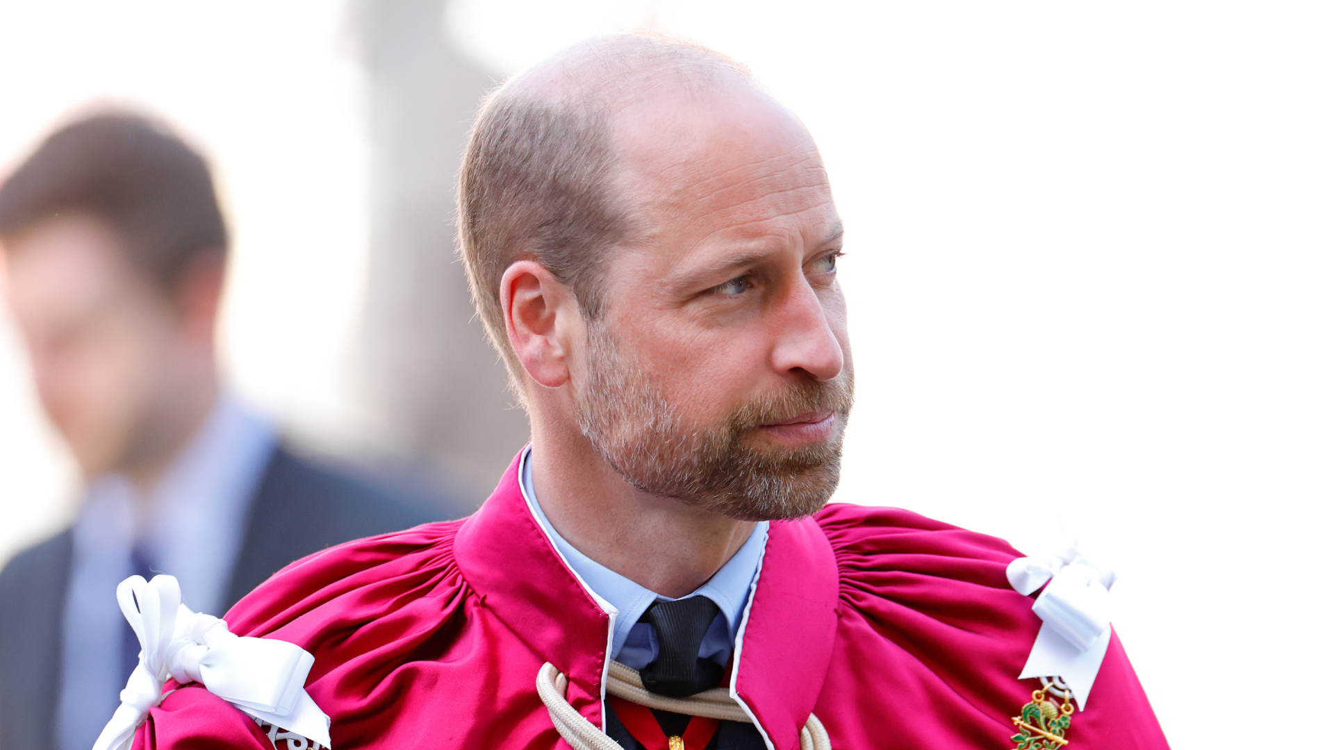 Prince William wearing a red robe 