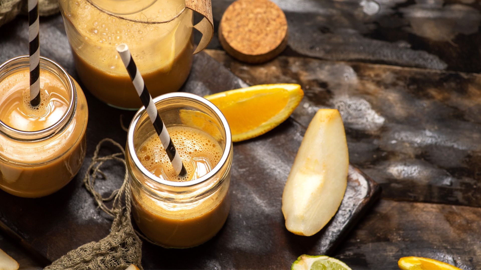 Pear smoothie in mason jar with paper straw
