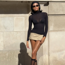 woman wearing chic holiday outfit idea 2025