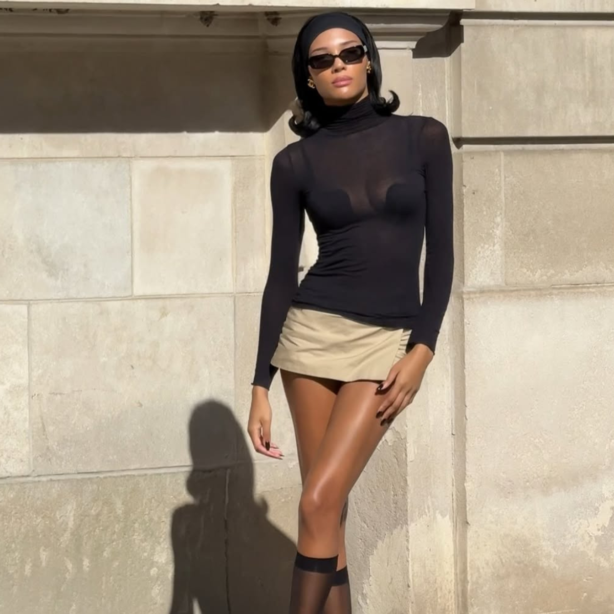 woman wearing chic holiday outfit idea 2025