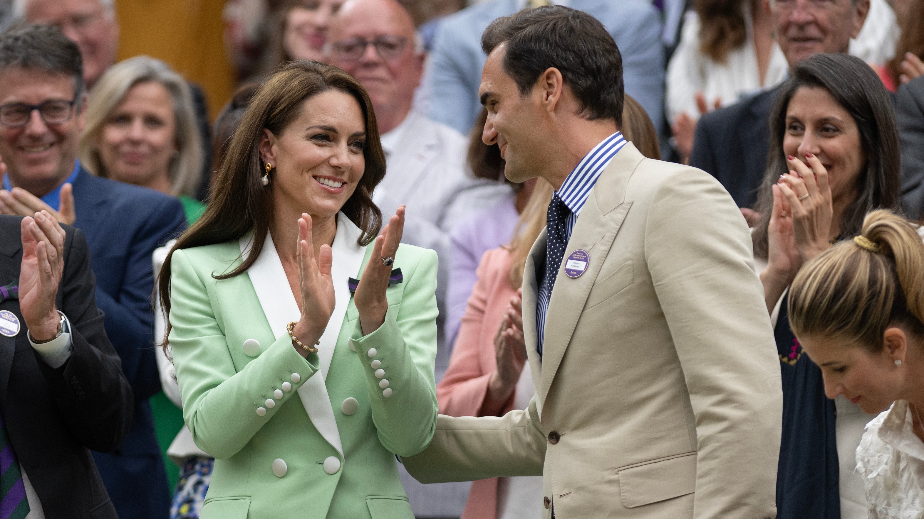 Roger Federer with Catherine, Princess of Wales applauding as he is presented to the crowd before play starts on centre court during day two of Wimbledon 2023