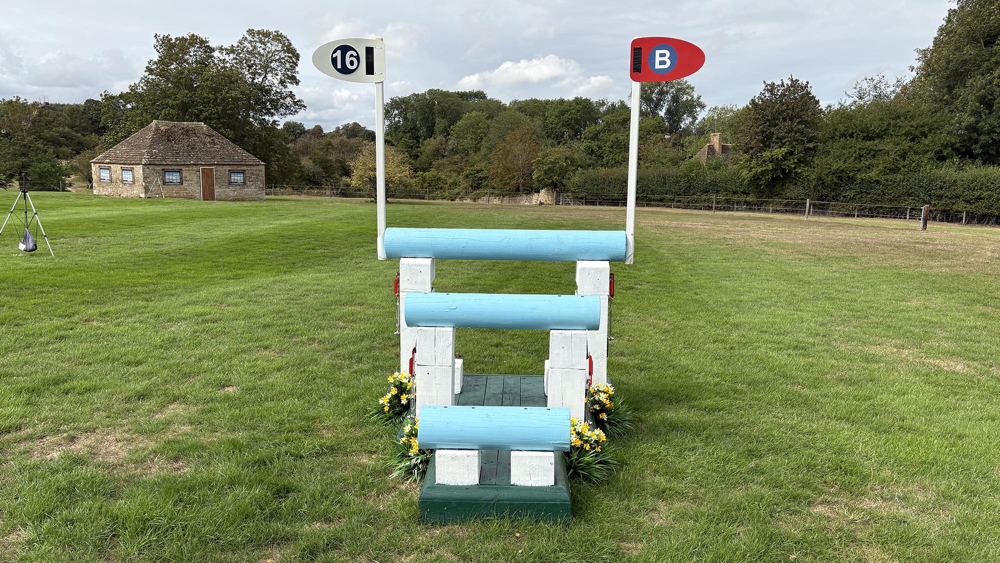 Blue triple brush arrowhead fence on the Burghley cross-country course 2026