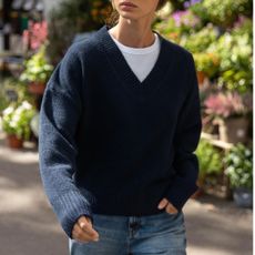 Woman in navy sweater and jeans