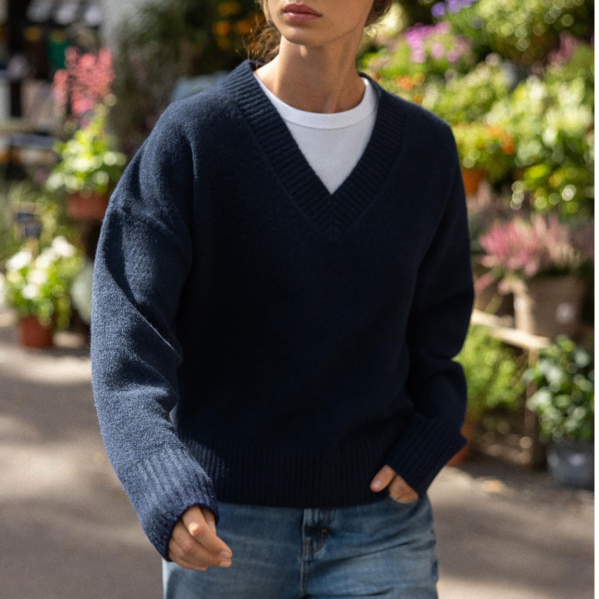 Woman in navy sweater and jeans