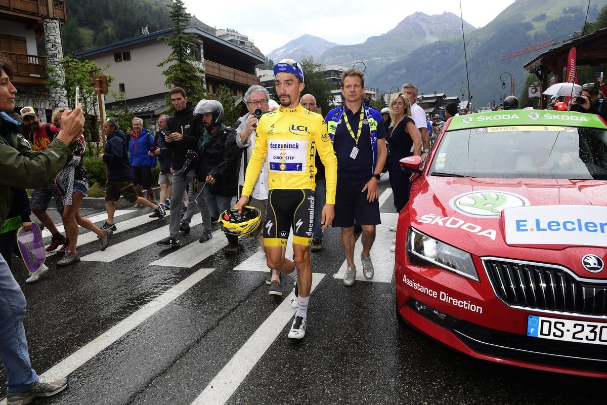 Julian Alaphilippe walks to his Deceuninck-QuickStep but he has lost the yellow jersey