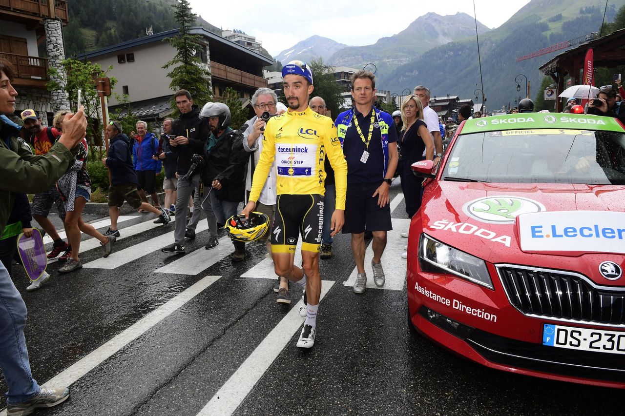 Julian Alaphilippe walks to his Deceuninck-QuickStep but he has lost the yellow jersey