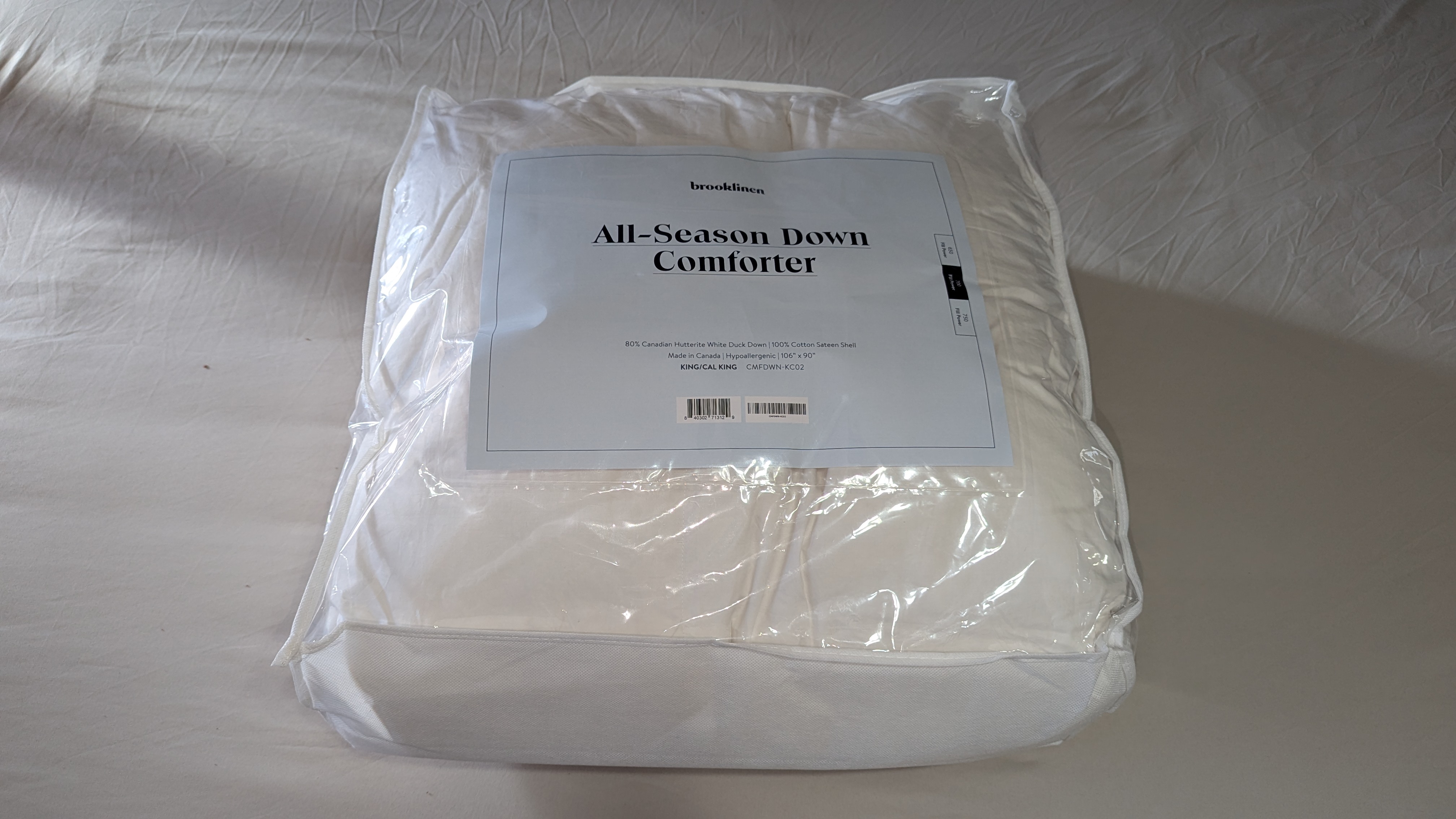 A white down comforter in bed