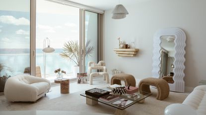 A neutral room made up of white and beige tones
