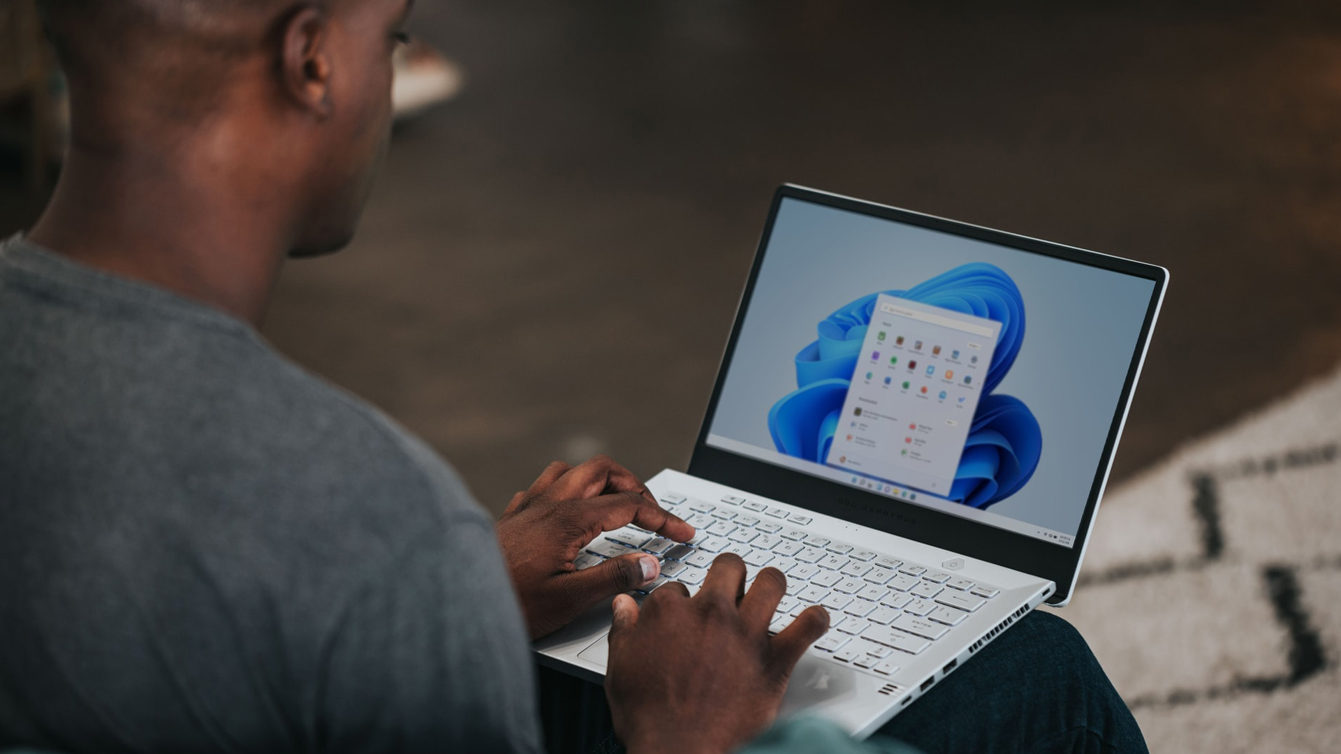 man working on Windows 11 laptop